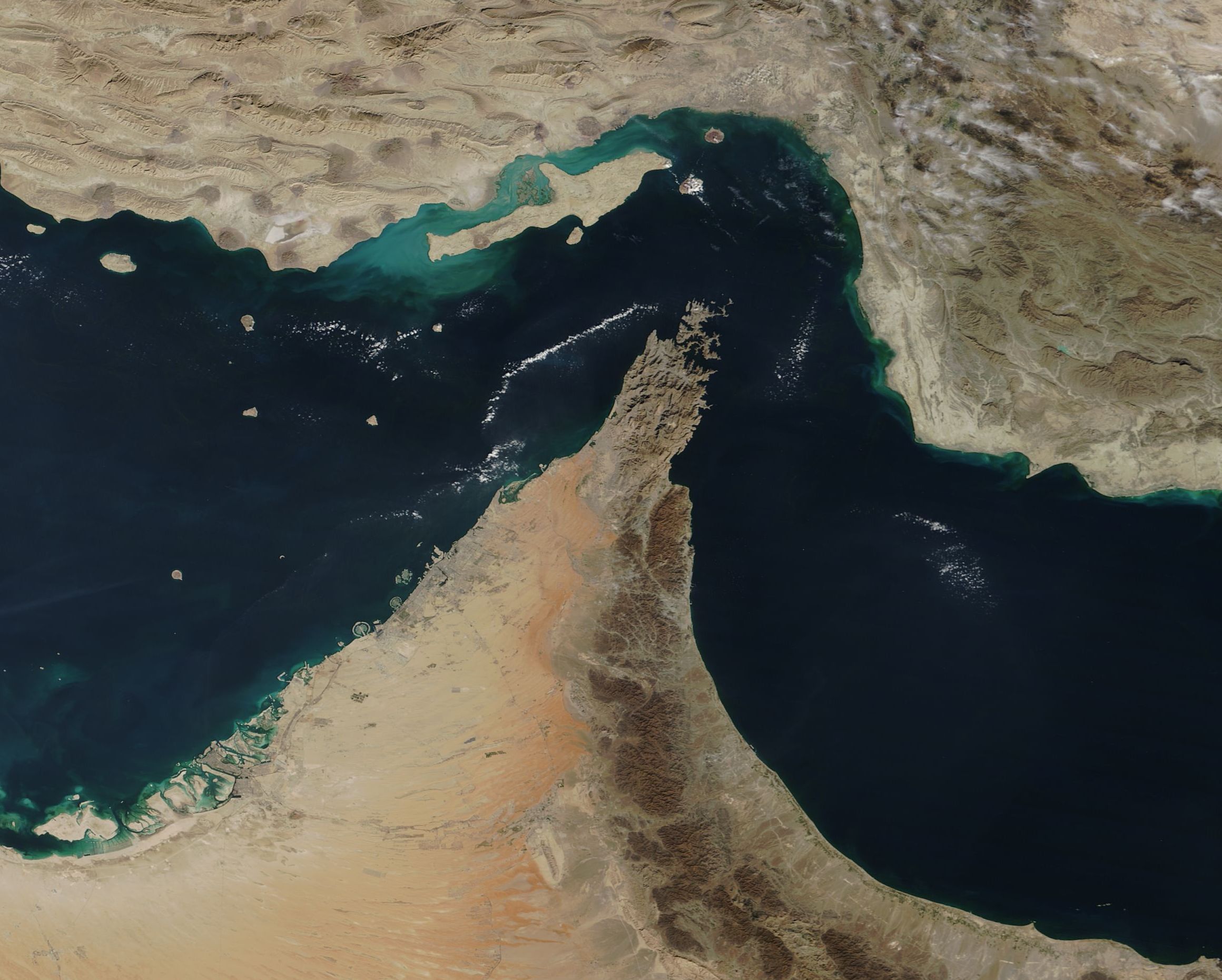 Strategic strait between Iran and Oman, critical global shipping corridor